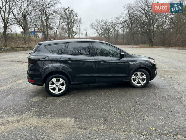 Черный Форд Эскейп, объемом двигателя 2.5 л и пробегом 200 тыс. км за 11700 $, фото 1 на Automoto.ua