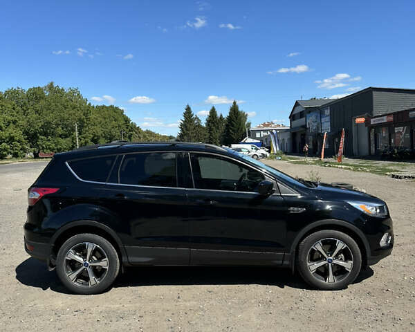 Черный Форд Эскейп, объемом двигателя 2 л и пробегом 111 тыс. км за 13300 $, фото 3 на Automoto.ua