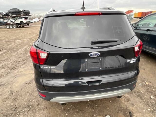 Черный Форд Эскейп, объемом двигателя 2 л и пробегом 115 тыс. км за 9900 $, фото 2 на Automoto.ua