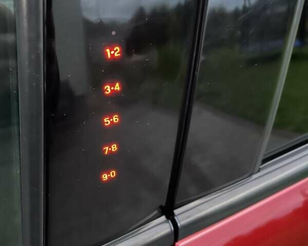 Красный Форд Эскейп, объемом двигателя 2 л и пробегом 170 тыс. км за 14000 $, фото 4 на Automoto.ua