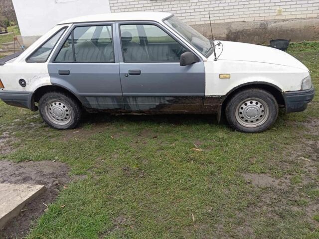 Белый Форд Эскорт, объемом двигателя 1.3 л и пробегом 123 тыс. км за 299 $, фото 1 на Automoto.ua