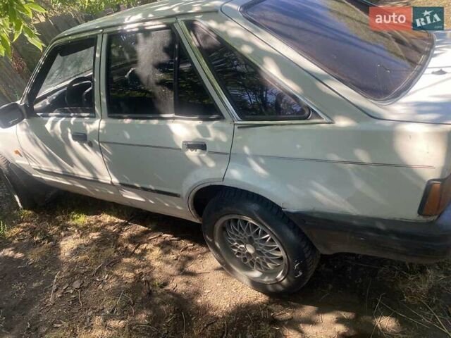 Белый Форд Эскорт, объемом двигателя 1.8 л и пробегом 370 тыс. км за 500 $, фото 1 на Automoto.ua