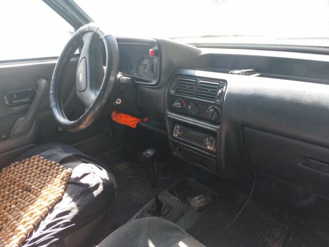 Белый Форд Эскорт, объемом двигателя 1 л и пробегом 300 тыс. км за 1500 $, фото 4 на Automoto.ua