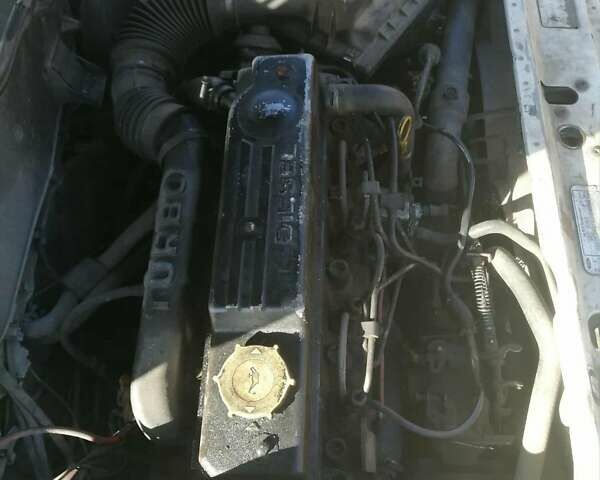 Белый Форд Эскорт, объемом двигателя 1.8 л и пробегом 300 тыс. км за 600 $, фото 1 на Automoto.ua