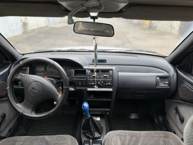 Білий Форд Ескорт, об'ємом двигуна 1.4 л та пробігом 250 тис. км за 750 $, фото 9 на Automoto.ua