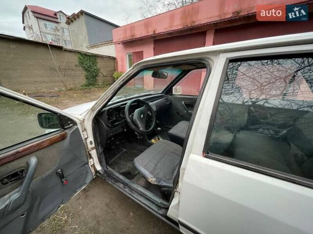 Белый Форд Эскорт, объемом двигателя 1.8 л и пробегом 150 тыс. км за 550 $, фото 7 на Automoto.ua