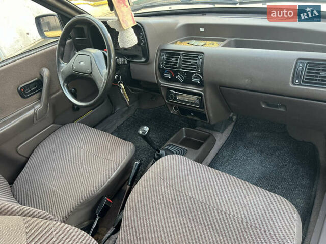 Бежевий Форд Ескорт, об'ємом двигуна 1.4 л та пробігом 150 тис. км за 880 $, фото 20 на Automoto.ua