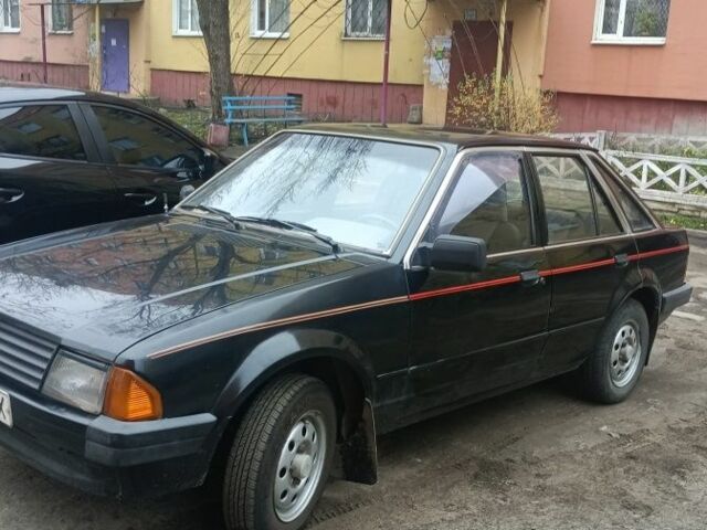 Черный Форд Эскорт, объемом двигателя 1.3 л и пробегом 200 тыс. км за 593 $, фото 1 на Automoto.ua