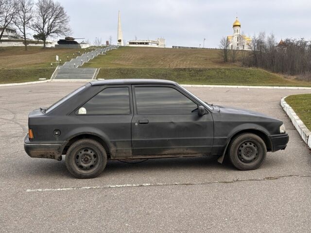 Черный Форд Эскорт, объемом двигателя 1.3 л и пробегом 300 тыс. км за 1000 $, фото 2 на Automoto.ua