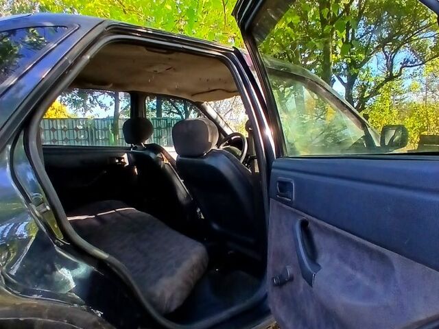 Черный Форд Эскорт, объемом двигателя 1.3 л и пробегом 487 тыс. км за 650 $, фото 6 на Automoto.ua