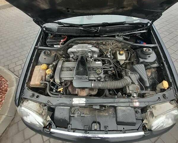 Черный Форд Эскорт, объемом двигателя 1.4 л и пробегом 350 тыс. км за 1450 $, фото 3 на Automoto.ua