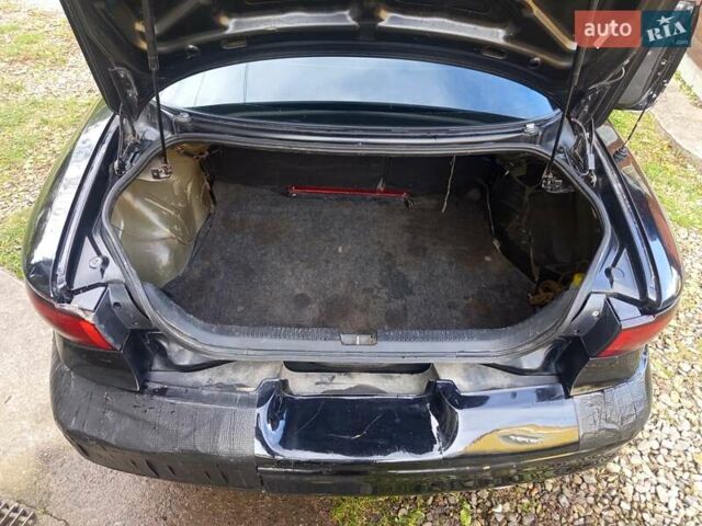 Черный Форд Эскорт, объемом двигателя 2 л и пробегом 147 тыс. км за 2000 $, фото 10 на Automoto.ua