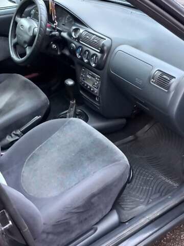 Черный Форд Эскорт, объемом двигателя 1.6 л и пробегом 349 тыс. км за 2000 $, фото 3 на Automoto.ua