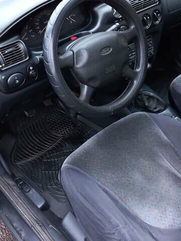 Черный Форд Эскорт, объемом двигателя 1.6 л и пробегом 349 тыс. км за 2000 $, фото 5 на Automoto.ua