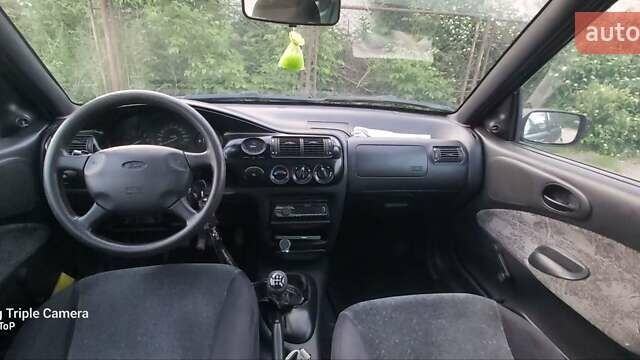 Фиолетовый Форд Эскорт, объемом двигателя 1.6 л и пробегом 270 тыс. км за 2000 $, фото 5 на Automoto.ua