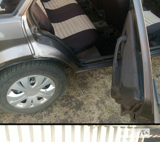 Коричневый Форд Эскорт, объемом двигателя 1.4 л и пробегом 100 тыс. км за 800 $, фото 7 на Automoto.ua