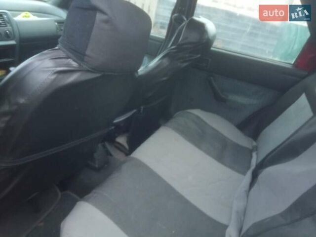 Красный Форд Эскорт, объемом двигателя 1.4 л и пробегом 233 тыс. км за 999 $, фото 2 на Automoto.ua