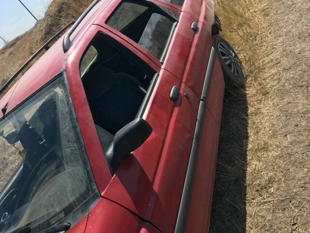 Красный Форд Эскорт, объемом двигателя 1.4 л и пробегом 68 тыс. км за 628 $, фото 1 на Automoto.ua