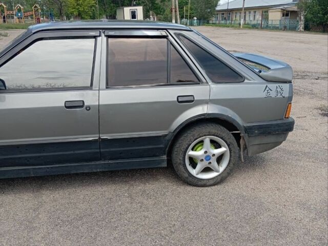 Серый Форд Эскорт, объемом двигателя 1.3 л и пробегом 287 тыс. км за 792 $, фото 3 на Automoto.ua