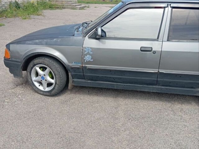 Серый Форд Эскорт, объемом двигателя 1.3 л и пробегом 287 тыс. км за 792 $, фото 2 на Automoto.ua