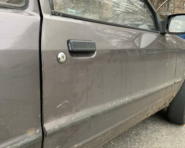 Серый Форд Эскорт, объемом двигателя 1.3 л и пробегом 200 тыс. км за 550 $, фото 2 на Automoto.ua