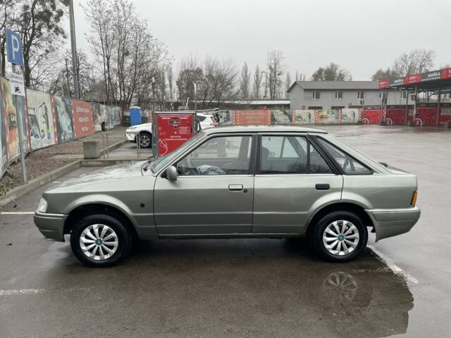 Серый Форд Эскорт, объемом двигателя 1.3 л и пробегом 333 тыс. км за 1000 $, фото 5 на Automoto.ua