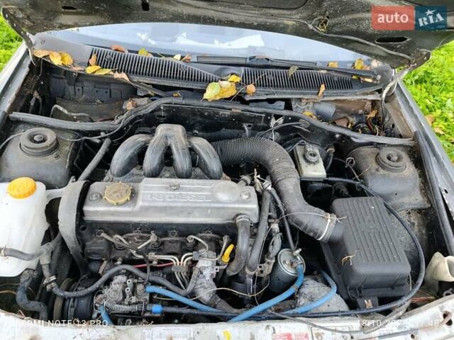 Серый Форд Эскорт, объемом двигателя 1.8 л и пробегом 320 тыс. км за 850 $, фото 2 на Automoto.ua