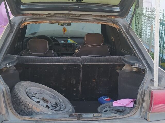 Серый Форд Эскорт, объемом двигателя 1.4 л и пробегом 300 тыс. км за 358 $, фото 1 на Automoto.ua