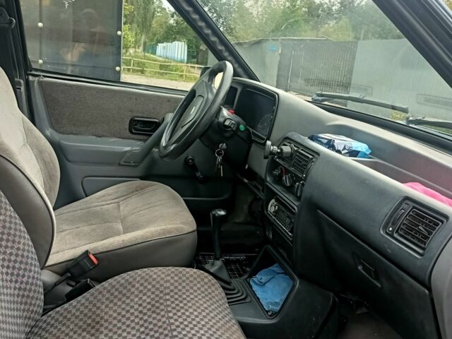 Серый Форд Эскорт, объемом двигателя 1.4 л и пробегом 300 тыс. км за 953 $, фото 4 на Automoto.ua