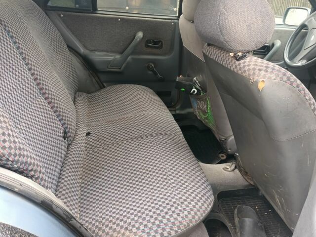 Серый Форд Эскорт, объемом двигателя 1.4 л и пробегом 300 тыс. км за 953 $, фото 5 на Automoto.ua