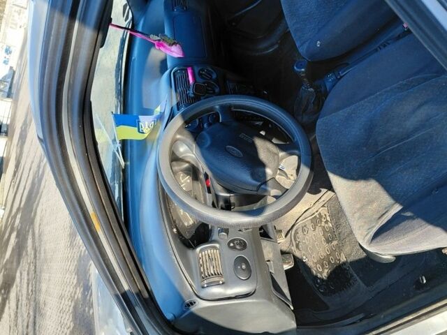 Сірий Форд Ескорт, об'ємом двигуна 1.8 л та пробігом 289 тис. км за 1000 $, фото 11 на Automoto.ua