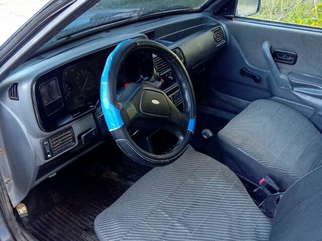 Синий Форд Эскорт, объемом двигателя 1.4 л и пробегом 215 тыс. км за 600 $, фото 4 на Automoto.ua