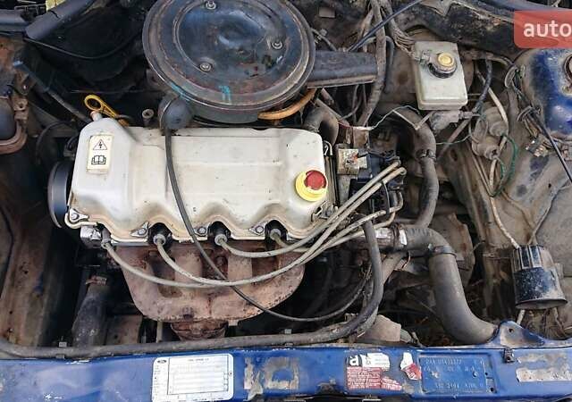 Синий Форд Эскорт, объемом двигателя 1.4 л и пробегом 500 тыс. км за 600 $, фото 5 на Automoto.ua