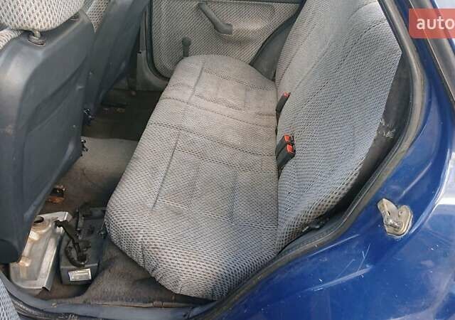 Синий Форд Эскорт, объемом двигателя 1.4 л и пробегом 500 тыс. км за 600 $, фото 4 на Automoto.ua