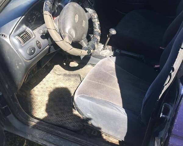 Синий Форд Эскорт, объемом двигателя 1.8 л и пробегом 400 тыс. км за 900 $, фото 4 на Automoto.ua