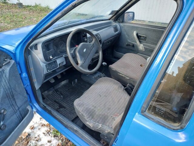 Синий Форд Эскорт, объемом двигателя 1.4 л и пробегом 256 тыс. км за 550 $, фото 5 на Automoto.ua