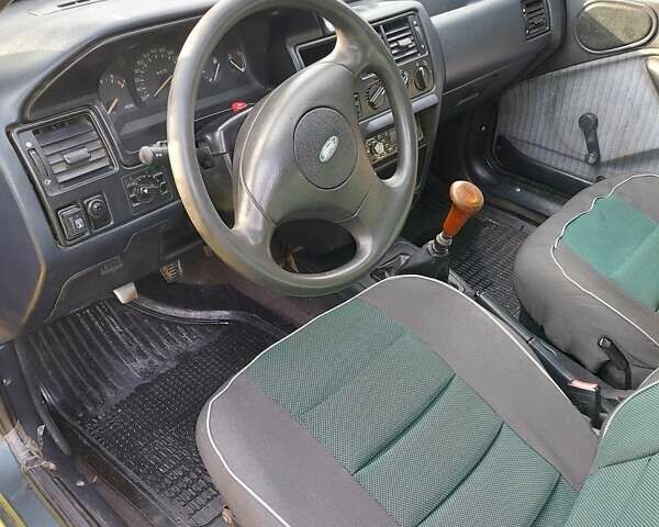 Зеленый Форд Эскорт, объемом двигателя 1.8 л и пробегом 436 тыс. км за 1999 $, фото 13 на Automoto.ua