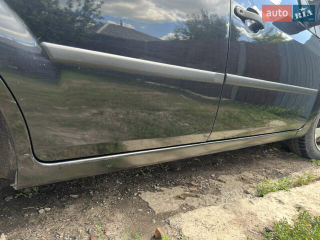 Черный Форд Фиеста, объемом двигателя 1.3 л и пробегом 232 тыс. км за 3800 $, фото 6 на Automoto.ua