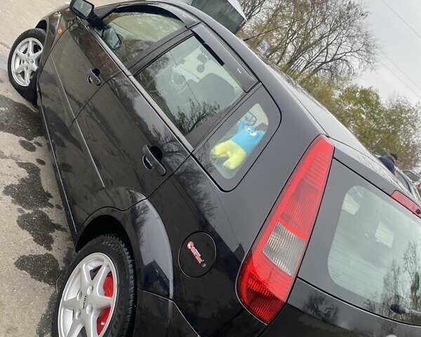 Черный Форд Фиеста, объемом двигателя 1.39 л и пробегом 180 тыс. км за 3600 $, фото 4 на Automoto.ua