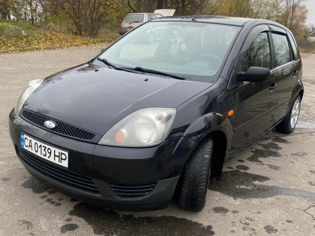 Черный Форд Фиеста, объемом двигателя 1.4 л и пробегом 160 тыс. км за 3600 $, фото 2 на Automoto.ua