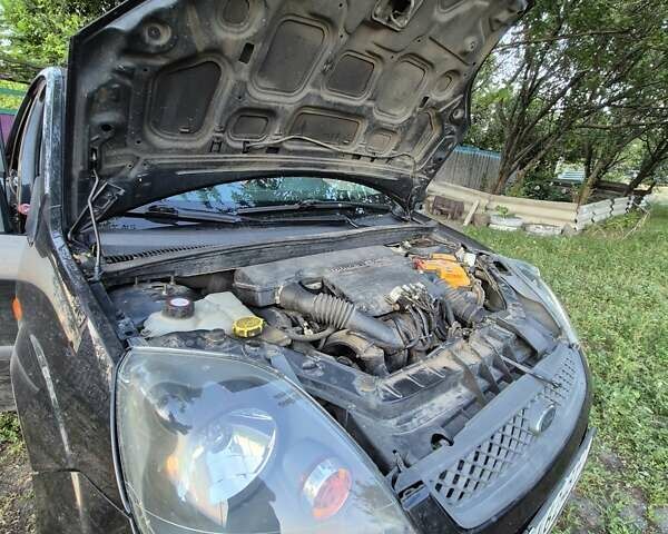 Черный Форд Фиеста, объемом двигателя 1.39 л и пробегом 231 тыс. км за 3900 $, фото 14 на Automoto.ua