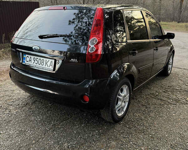 Черный Форд Фиеста, объемом двигателя 1.3 л и пробегом 276 тыс. км за 4300 $, фото 11 на Automoto.ua