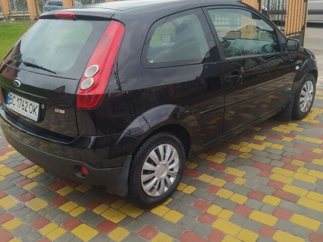 Черный Форд Фиеста, объемом двигателя 1.4 л и пробегом 234 тыс. км за 3350 $, фото 2 на Automoto.ua