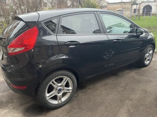 Черный Форд Фиеста, объемом двигателя 1.4 л и пробегом 147 тыс. км за 5254 $, фото 1 на Automoto.ua