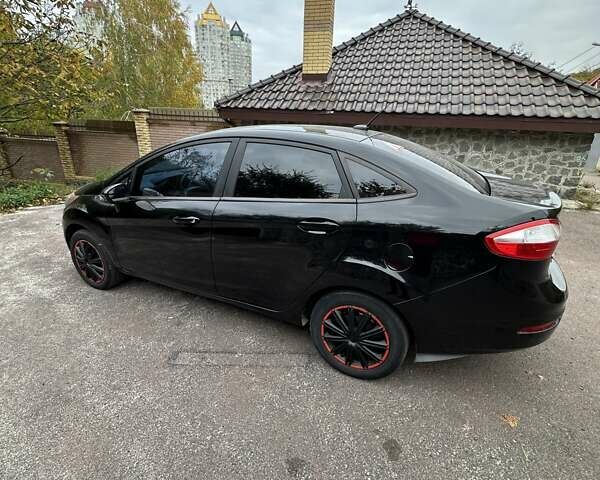 Черный Форд Фиеста, объемом двигателя 1.6 л и пробегом 77 тыс. км за 10500 $, фото 4 на Automoto.ua