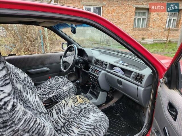 Красный Форд Фиеста, объемом двигателя 1.1 л и пробегом 358 тыс. км за 650 $, фото 6 на Automoto.ua