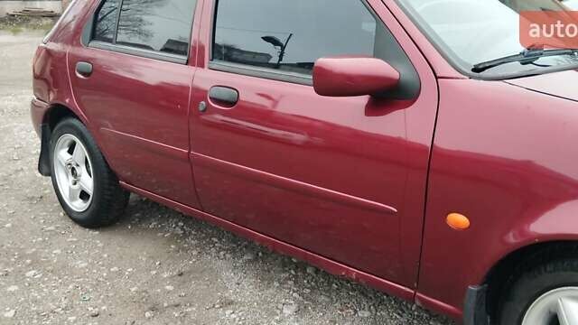 Красный Форд Фиеста, объемом двигателя 1.25 л и пробегом 260 тыс. км за 1550 $, фото 6 на Automoto.ua