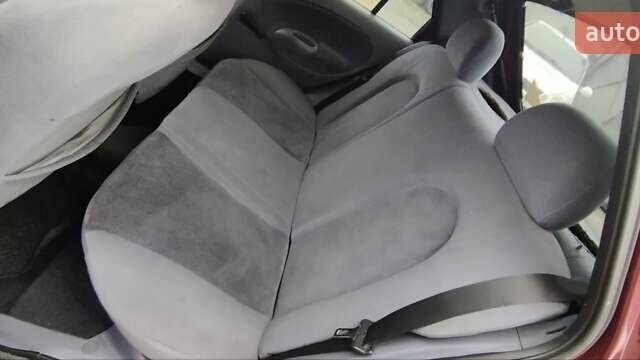 Красный Форд Фиеста, объемом двигателя 1.25 л и пробегом 260 тыс. км за 1550 $, фото 10 на Automoto.ua