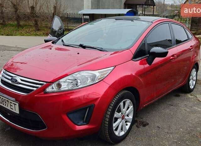 Червоний Форд Фієста, об'ємом двигуна 1.6 л та пробігом 166 тис. км за 7200 $, фото 4 на Automoto.ua