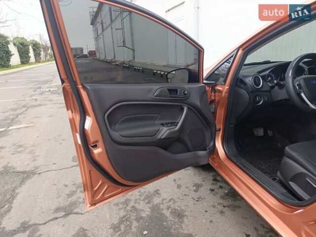 Оранжевый Форд Фиеста, объемом двигателя 1.6 л и пробегом 144 тыс. км за 7999 $, фото 13 на Automoto.ua